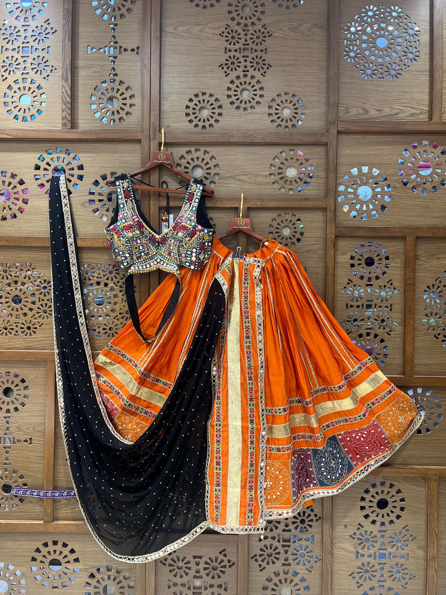 Orange & Black Mirror Work Chaniya Choli with Traditional Patch Border