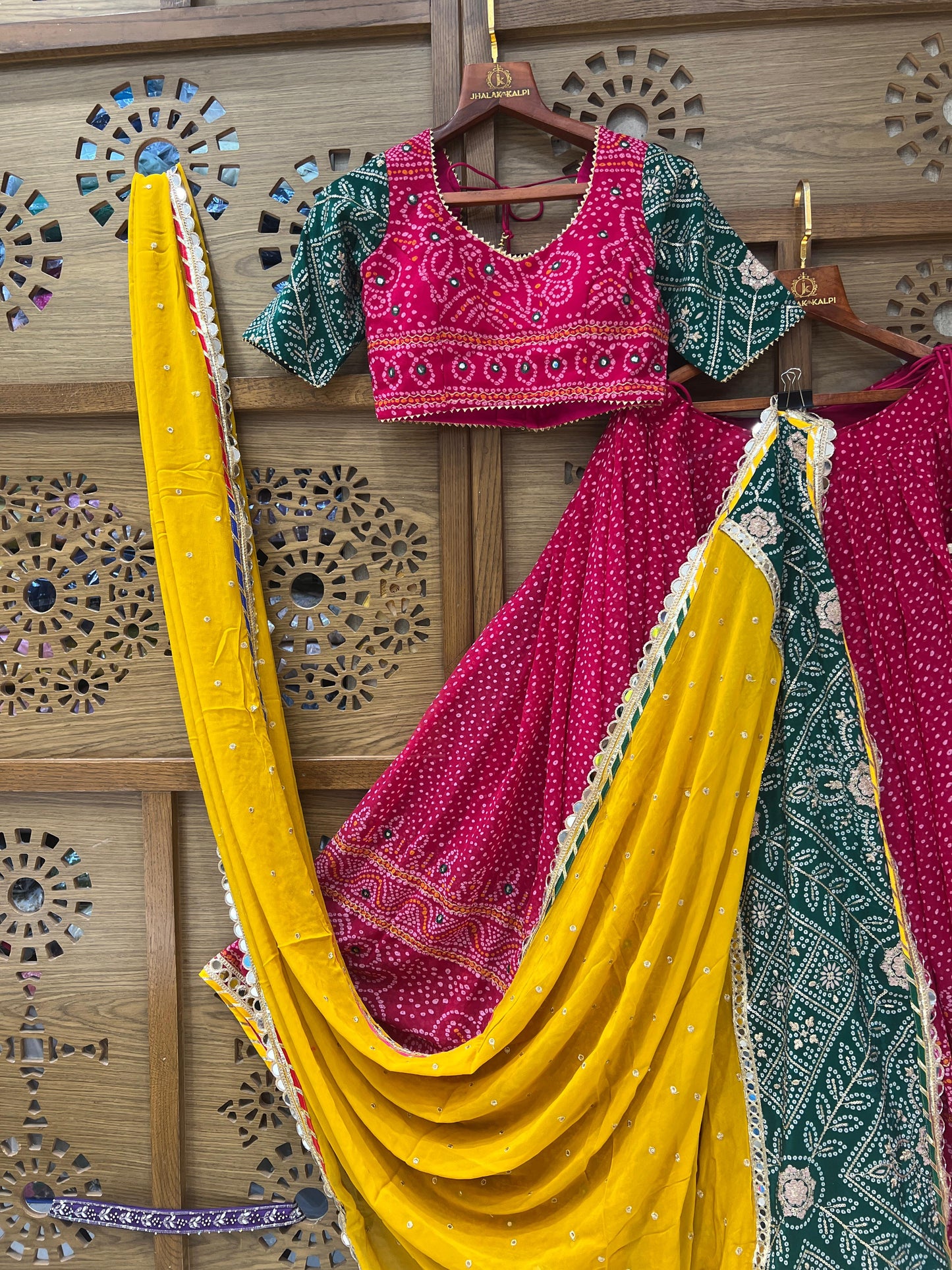 Rani Pink and Green Bandhej Navratri Chaniya Choli with Yellow Dupatta