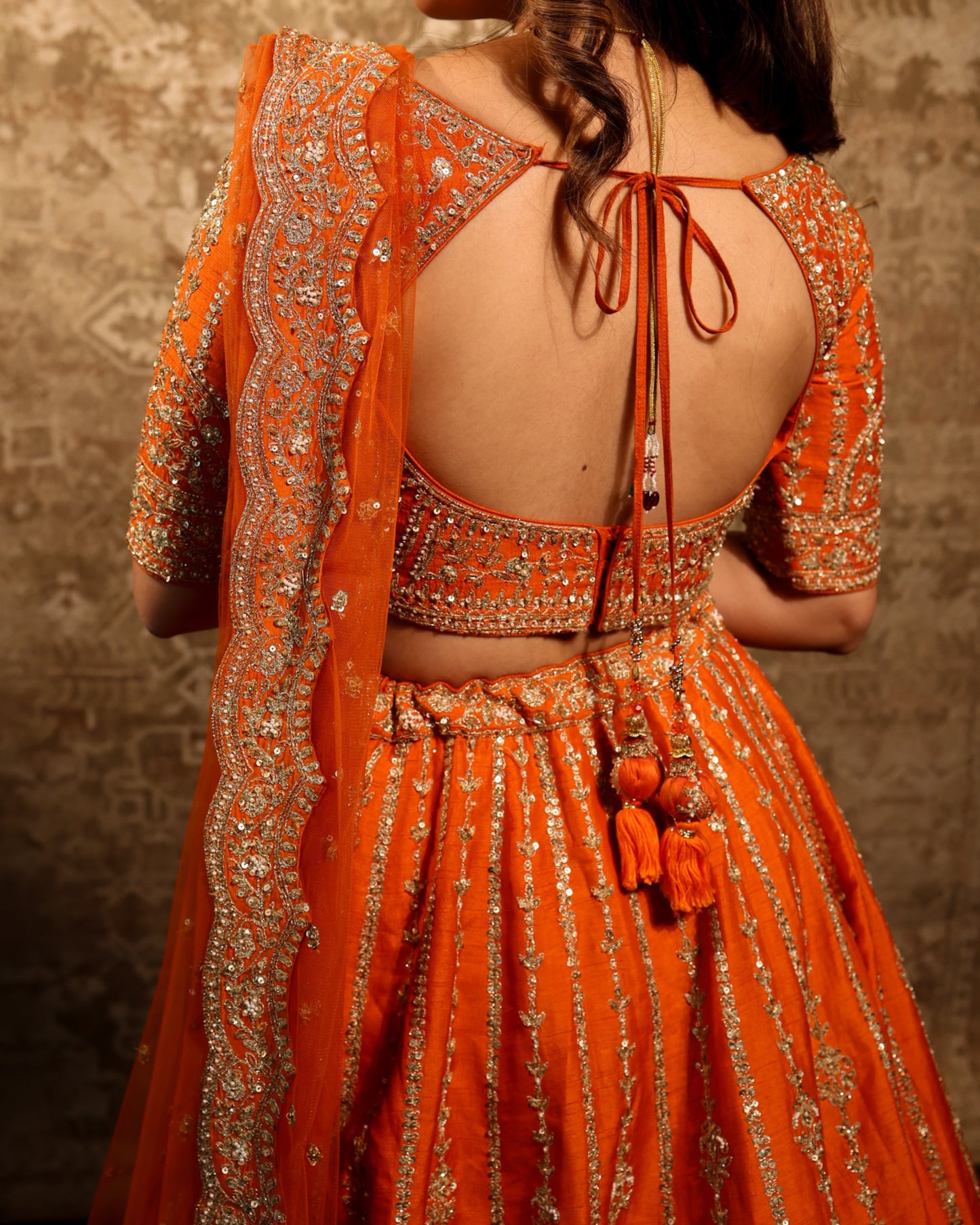 A Silent Promise – Orange Gold Embroidered Bridal Lehenga