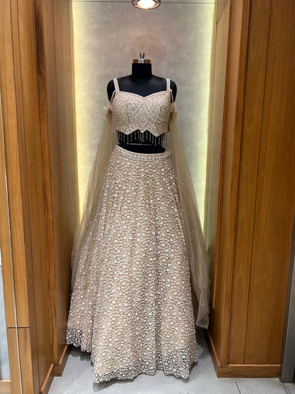 Champagne Gold Embroidered Lehenga with Beaded Blouse and Net Cape Dupatta
