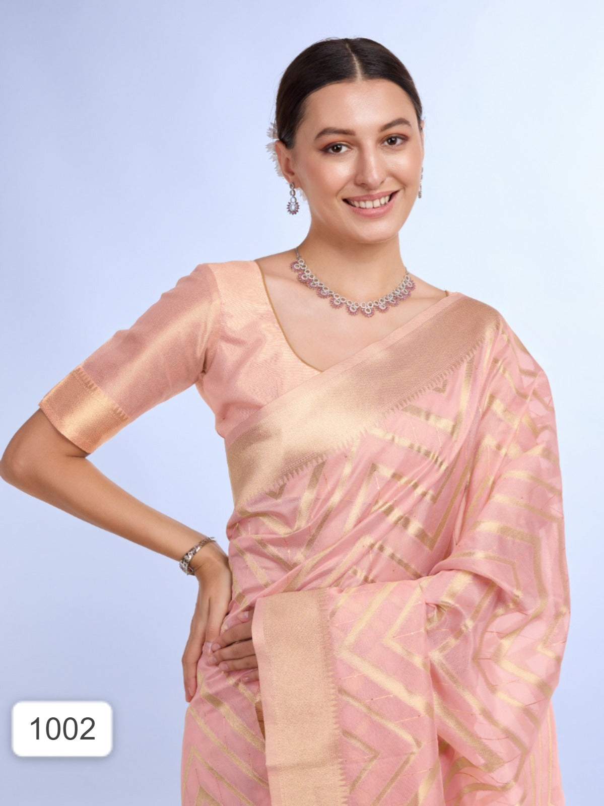 Peach Embroidered Saree with Golden Border and Tassels