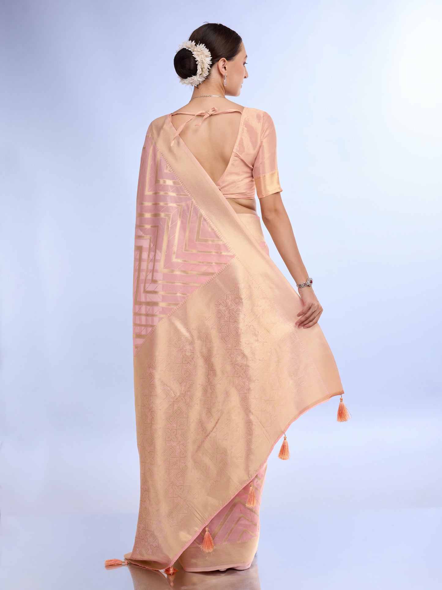 Peach Embroidered Saree with Golden Border and Tassels