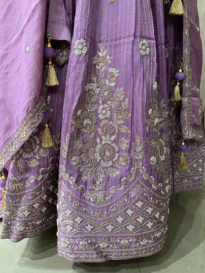 Lavender Embroidered Lehenga Choli with Mirror and Tassel Detailing Description: