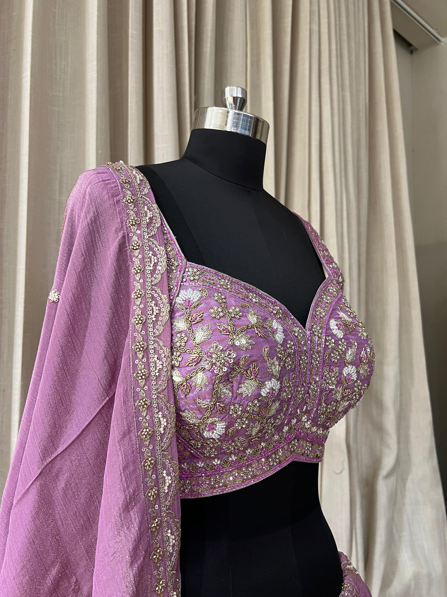 Lavender Embroidered Lehenga Choli with Mirror and Tassel Detailing Description: