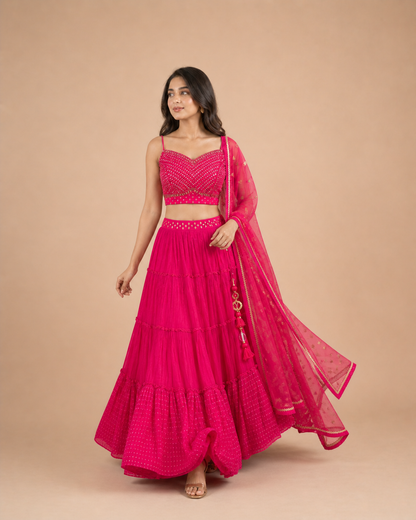 Rani Pink Mirror Work Lehenga Choli with Tiered Skirt & Net Dupatta