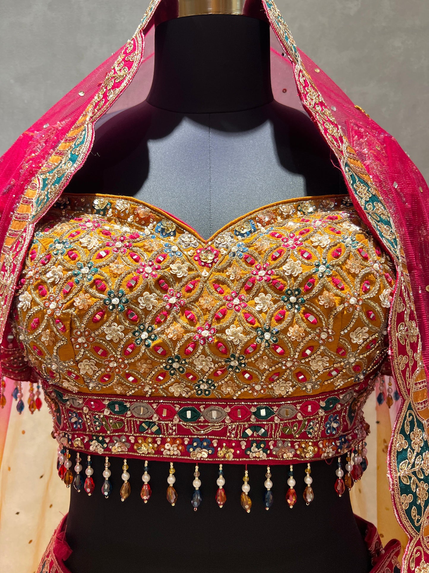 Rani Pink Multicolour Panelled Embroidered Lehenga with Mirrorwork Blouse & Dupatta