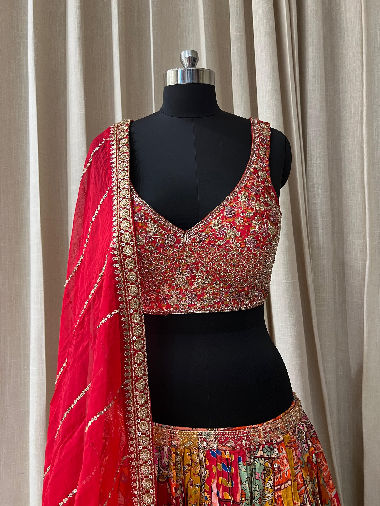 Red and Multicolor Patola Print Bridal Lehenga Choli with Embroidered Blouse