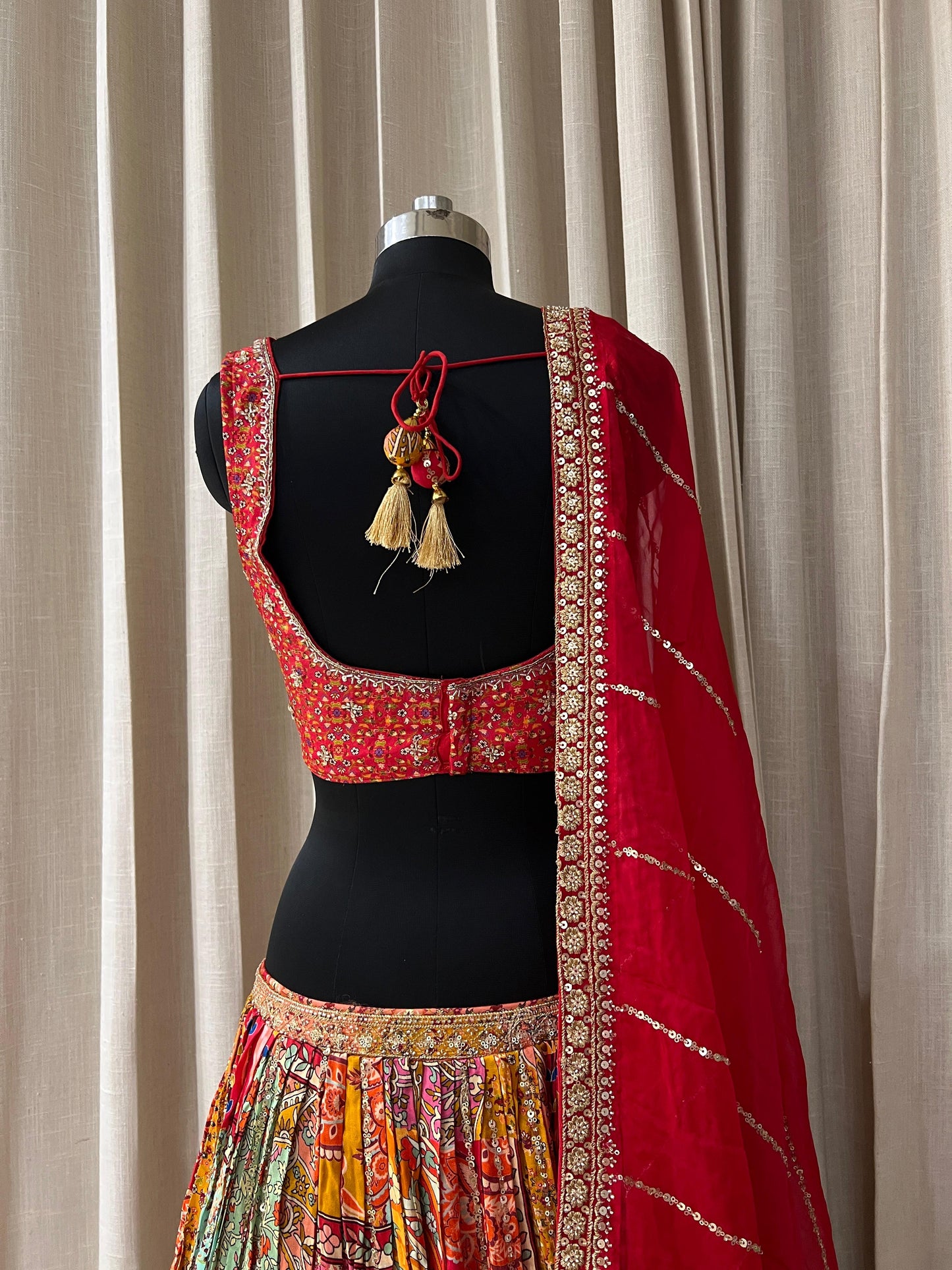 Red and Multicolor Patola Print Bridal Lehenga Choli with Embroidered Blouse