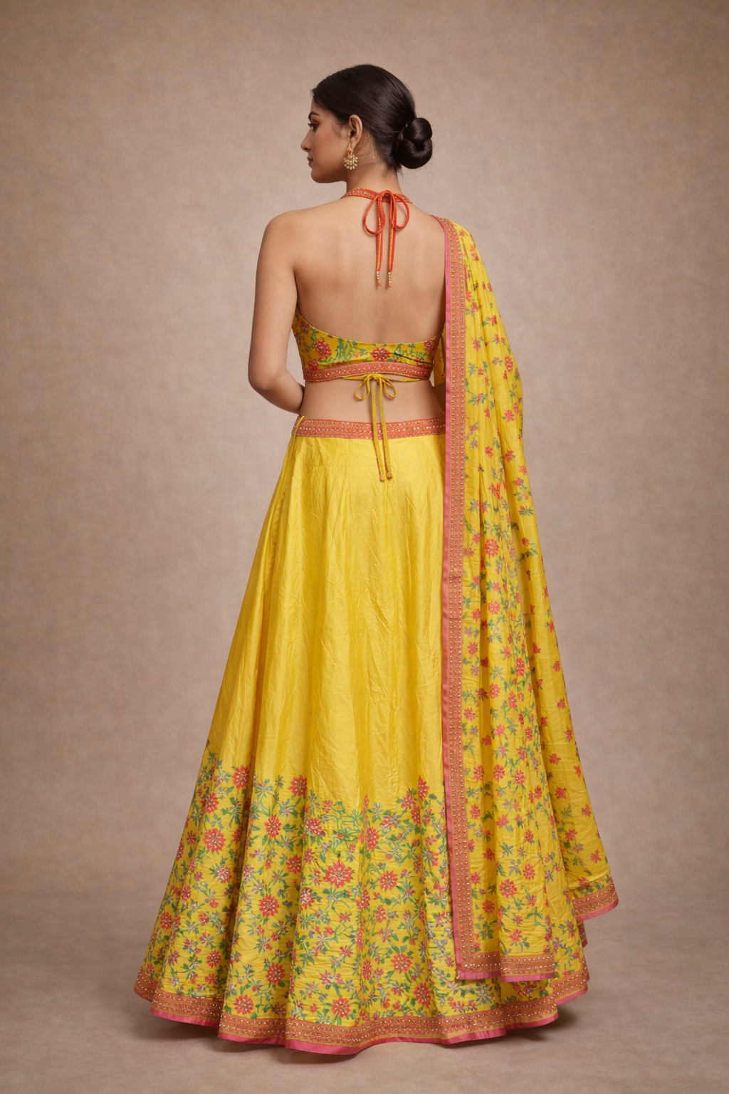 Sunshine Yellow and Pink Floral Embroidered Halter Neck Lehenga Choli
