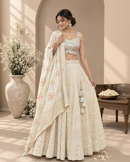 Ivory White Embroidered Lehenga Choli Set with Pastel Floral Dupatta, Intricate Threadwork & Tassel Details | Festive Wedding Wear