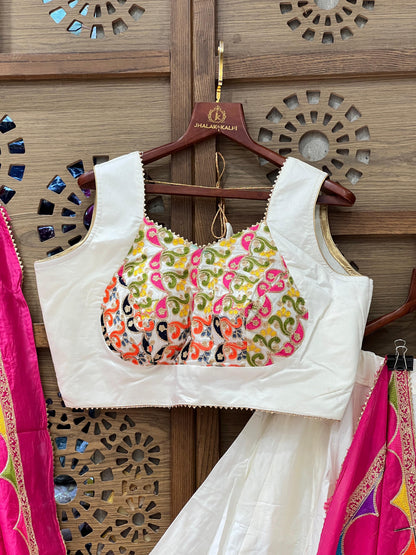 White and Rani Pink Navratri Chaniya Choli with Multicolor Embroidery and Paisley Work